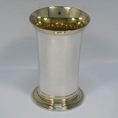 A heavy and very handsome Sterling Silver beaker cup, having a plain round body with tapering flared sides, and sitting on a collet foot with an applied reeded border, together with a gold-gilt interior and upper band. This elegant silver beaker was made by the Marlow Brothers of London in 1998. The dimensions of this fine hand-made silver beaker cup are height 11.5 cms (4.5 inches), diameter at top 7.5 cms (3 inches), and it weighs approx. 206g (6.6 troy ounces).   
