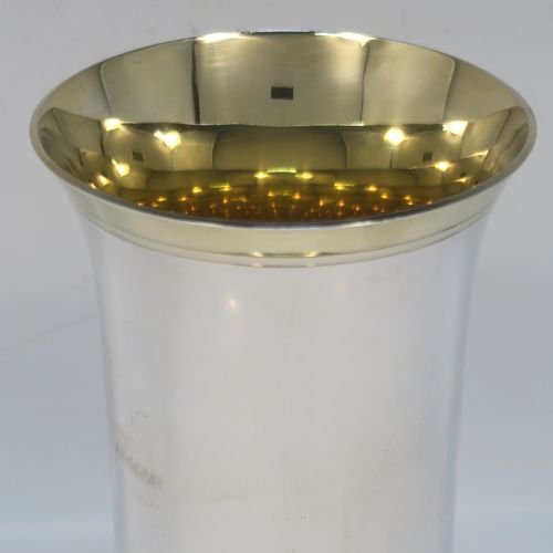 A heavy and very handsome Sterling Silver beaker cup, having a plain round body with tapering flared sides, and sitting on a collet foot with an applied reeded border, together with a gold-gilt interior and upper band. This elegant silver beaker was made by the Marlow Brothers of London in 1998. The dimensions of this fine hand-made silver beaker cup are height 11.5 cms (4.5 inches), diameter at top 7.5 cms (3 inches), and it weighs approx. 206g (6.6 troy ounces).