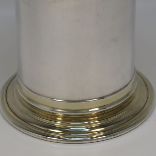A heavy and very handsome Sterling Silver beaker cup, having a plain round body with tapering flared sides, and sitting on a collet foot with an applied reeded border, together with a gold-gilt interior and upper band. This elegant silver beaker was made by the Marlow Brothers of London in 1998. The dimensions of this fine hand-made silver beaker cup are height 11.5 cms (4.5 inches), diameter at top 7.5 cms (3 inches), and it weighs approx. 206g (6.6 troy ounces).