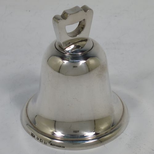 A handsome Sterling Silver table bell having a plain round body with a cast canon style handle, and an original silver clapper. Made by Mappin and Webb of Birmingham in 1935. The dimensions of this fine hand-made silver table bell are height 8 cms (3 inches), diameter at base 6.5 cms (2.6 inches), and it weighs approx. 120g (3.8 troy ounces).   