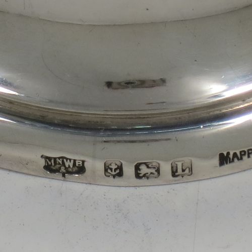 A handsome Sterling Silver table bell having a plain round body with a cast canon style handle, and an original silver clapper. Made by Mappin and Webb of Birmingham in 1935. The dimensions of this fine hand-made silver table bell are height 8 cms (3 inches), diameter at base 6.5 cms (2.6 inches), and it weighs approx. 120g (3.8 troy ounces).
