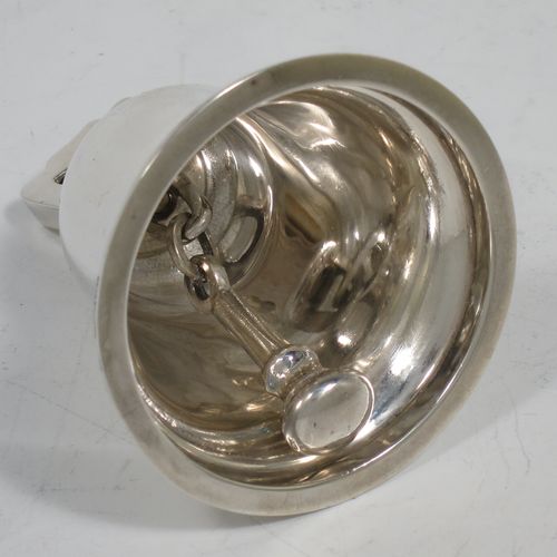 A handsome Sterling Silver table bell having a plain round body with a cast canon style handle, and an original silver clapper. Made by Mappin and Webb of Birmingham in 1935. The dimensions of this fine hand-made silver table bell are height 8 cms (3 inches), diameter at base 6.5 cms (2.6 inches), and it weighs approx. 120g (3.8 troy ounces).