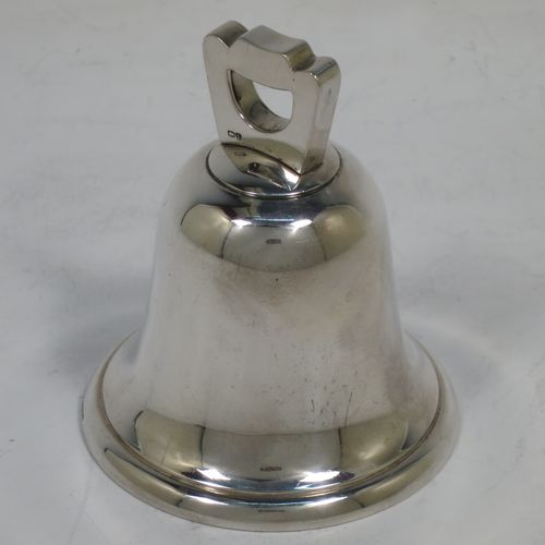 A handsome Sterling Silver table bell having a plain round body with a cast canon style handle, and an original silver clapper. Made by Mappin and Webb of Birmingham in 1935. The dimensions of this fine hand-made silver table bell are height 8 cms (3 inches), diameter at base 6.5 cms (2.6 inches), and it weighs approx. 120g (3.8 troy ounces).