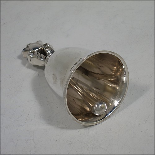 A very pretty Sterling Silver table bell having a plain round body with a cast Acorn pattern handle, and an original silver clapper. Hallmarked for C. J. Vander of London in 1960, and originally designed by Johan Rohde for Georg Jensen. The dimensions of this fine hand-made silver table bell are height 8.5 cms (3.3 inches), diameter at base 5 cms (2 inches), and it weighs approx. 88g (2.8 troy ounces).