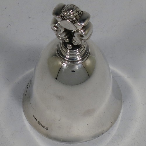 A very pretty Sterling Silver table bell having a plain round body with a cast Acorn pattern handle, and an original silver clapper. Hallmarked for C. J. Vander of London in 1960, and originally designed by Johan Rohde for Georg Jensen. The dimensions of this fine hand-made silver table bell are height 8.5 cms (3.3 inches), diameter at base 5 cms (2 inches), and it weighs approx. 88g (2.8 troy ounces).