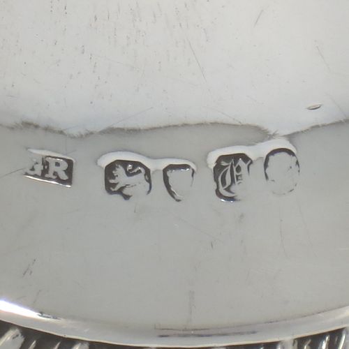 A very elegant Antique Victorian Sterling Silver table bell having a plain round body with an applied gadroon border, a cast octagonal baluster handle, and an original silver clapper. Made by George John Richards of London in 1855. The dimensions of this fine hand-made antique silver table bell are height 13 cms (5 inches), diameter at base 7 cms (2.75 inches), and it weighs approx. 132g (4.3 troy ounces).