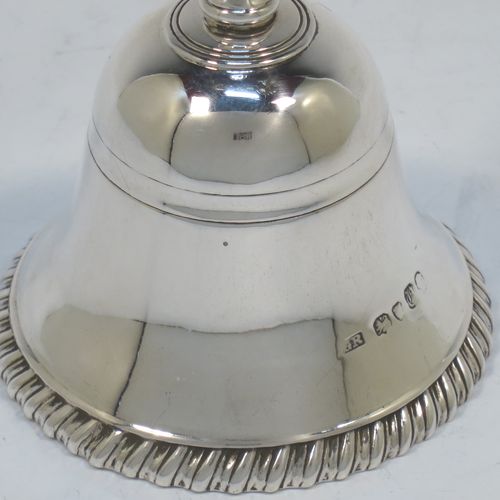 A very elegant Antique Victorian Sterling Silver table bell having a plain round body with an applied gadroon border, a cast octagonal baluster handle, and an original silver clapper. Made by George John Richards of London in 1855. The dimensions of this fine hand-made antique silver table bell are height 13 cms (5 inches), diameter at base 7 cms (2.75 inches), and it weighs approx. 132g (4.3 troy ounces).