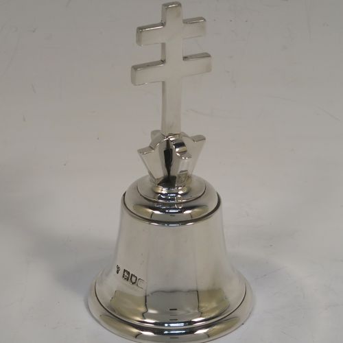 A very handsome and heavy Antique Edwardian Sterling Silver ecclesiastical style table bell having a plain round body with applied reeded borders, a cast two-bar cross of Lorraine (or cross of Anjou) handle, and an original silver clapper. This elegant antique silver table bell was made by Holland, Aldwinckle, and Slater of London in 1902. The dimensions of this fine hand-made antique silver table bell are height 13 cms (5 inches), diameter at base 7 cms (2.75 inches), and it weighs approx. 409g (13.2 troy ounces).   