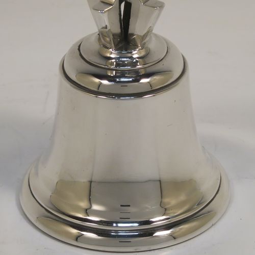 A very handsome and heavy Antique Edwardian Sterling Silver ecclesiastical style table bell having a plain round body with applied reeded borders, a cast two-bar cross of Lorraine (or cross of Anjou) handle, and an original silver clapper. This elegant antique silver table bell was made by Holland, Aldwinckle, and Slater of London in 1902. The dimensions of this fine hand-made antique silver table bell are height 13 cms (5 inches), diameter at base 7 cms (2.75 inches), and it weighs approx. 409g (13.2 troy ounces).