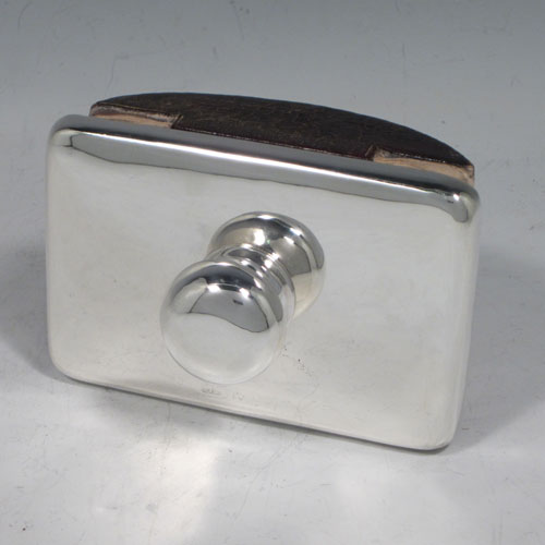 Antique Edwardian sterling silver Rocker Blotter, having a very plain rectangular body with rounded corners, a leather covered rocker base, and a plain round handle that screws in to secure the rocker base and blotting paper to the upper body. Made in Chester in 1906. The dimensions of this fine hand-made antique silver rocker blotter are length 11.5 cms (4.5 inches), height 6.5 cms (2.5 inches), and width 7.5 cms (3 inches).