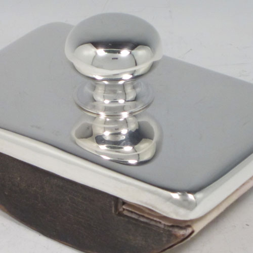Antique Edwardian sterling silver Rocker Blotter, having a very plain rectangular body with rounded corners, a leather covered rocker base, and a plain round handle that screws in to secure the rocker base and blotting paper to the upper body. Made in Chester in 1906. The dimensions of this fine hand-made antique silver rocker blotter are length 11.5 cms (4.5 inches), height 6.5 cms (2.5 inches), and width 7.5 cms (3 inches).