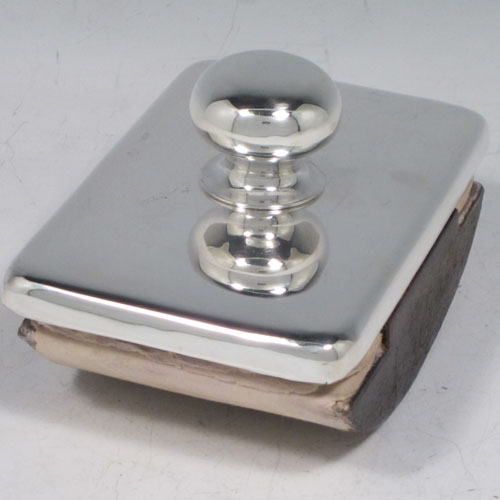 Antique Edwardian sterling silver Rocker Blotter, having a very plain rectangular body with rounded corners, a leather covered rocker base, and a plain round handle that screws in to secure the rocker base and blotting paper to the upper body. Made in Chester in 1906. The dimensions of this fine hand-made antique silver rocker blotter are length 11.5 cms (4.5 inches), height 6.5 cms (2.5 inches), and width 7.5 cms (3 inches).