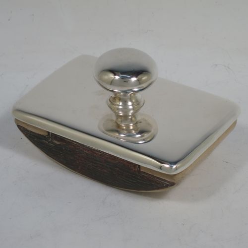 A handsome Antique Sterling Silver Rocker Blotter, having a very plain rectangular body with rounded corners, a leather covered rocker base, and a plain round handle that screws in to secure the rocker base and blotting paper to the upper body. Made by Stokes and Ireland of Chester in 1911. The dimensions of this fine hand-made antique silver rocker blotter are length 10 cms (4 inches), height 6 cms (2.3 inches), and width 6.5 cms (2.5 inches).