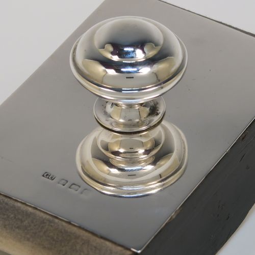 A handsome Antique Sterling Silver Rocker Blotter, having a very plain rectangular body, a solid wooden rocker base, and a plain round domed handle that screws in to secure the rocker base and blotting paper to the upper body. This elegant silver rocker blotter was made by George Unite of Birmingham in 1915. The dimensions of this fine hand-made antique silver rocker blotter are length 11 cms (4.3 inches), height 7 cms (2.75 inches), and width 7 cms (2.75 inches).