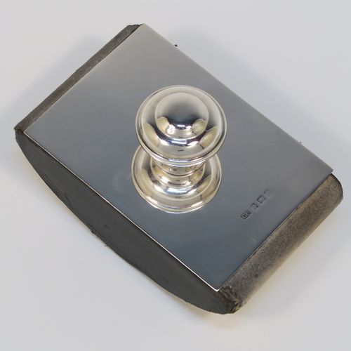 A handsome Antique Sterling Silver Rocker Blotter, having a very plain rectangular body, a solid wooden rocker base, and a plain round domed handle that screws in to secure the rocker base and blotting paper to the upper body. This elegant silver rocker blotter was made by George Unite of Birmingham in 1915. The dimensions of this fine hand-made antique silver rocker blotter are length 11 cms (4.3 inches), height 7 cms (2.75 inches), and width 7 cms (2.75 inches).