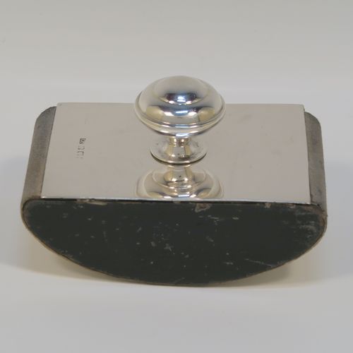 A handsome Antique Sterling Silver Rocker Blotter, having a very plain rectangular body, a solid wooden rocker base, and a plain round domed handle that screws in to secure the rocker base and blotting paper to the upper body. This elegant silver rocker blotter was made by George Unite of Birmingham in 1915. The dimensions of this fine hand-made antique silver rocker blotter are length 11 cms (4.3 inches), height 7 cms (2.75 inches), and width 7 cms (2.75 inches).