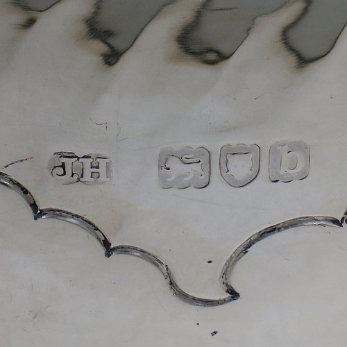 An Antique Victorian Sterling Silver large table bowl, having a round body with an applied reeded border and hand-chased half swirl-fluted decoration, all sitting on a pedestal foot which is also fluted. Made by Sibray, Hall & Co., of London in 1897. The dimensions of this fine hand-made antique silver bowl are diameter 25.5 cms (10 inches), height 19 cms (7.5 inches), and it weighs approx. 1,041g (33.6 troy ounces).