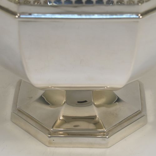 A very handsome Antique Sterling Silver table bowl, having a plain octagonal panelled body, with an applied neoclassical style and hand-pierced top border, and all sitting on a pedestal foot. This beautiful antique silver bowl was made by Charles S. Green and Co., of Birmingham in 1914. The dimensions of this fine hand-made antique silver bowl are width 23 cms (9 inches), height 18.5 cms (7.25 inches), and it weighs approx. 828g (27 troy ounces).
