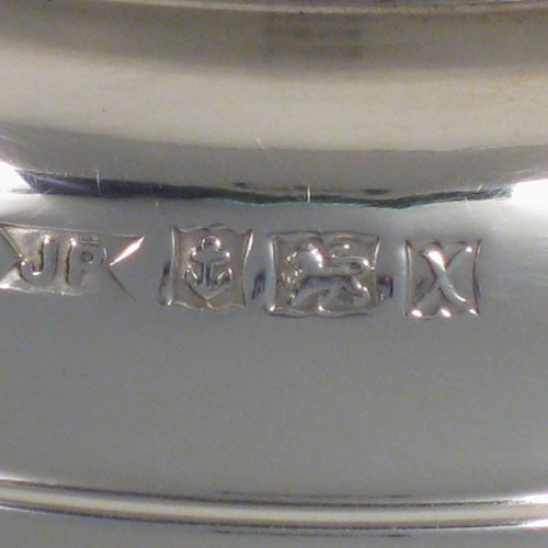 A handsome and large Sterling Silver bowl, having a plain round body, two cast lion-mask ring handles, and sitting on a pedestal foot. This elegant silver table bowl was made in Birmingham in 1972. The dimensions of this fine hand-made silver bowl are diameter 26 cms (10.25 inches), height 19 cms (7.5 inches), and it weighs approx. 1,234g (39.8 troy ounces).