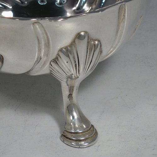 An Antique Victorian Sterling Silver bowl, having a round body, with hand-chased swirl half-fluting, a shaped pie-crust border, and all sitting on three cast hoof feet with shell shoulders. Made by the Barnard Brothers of London in 1888. The dimensions of this fine hand-made antique silver bowl are height 7 cms (2.75 inches), diameter 13 cms (5.25 inches), and it weighs approx. 195g (6.3 troy ounces).