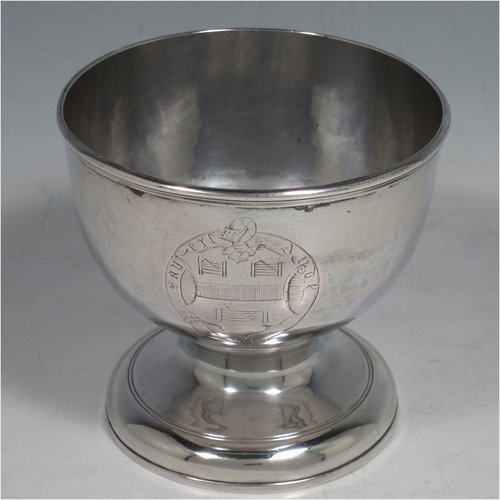 A rare Antique Georgian George II Sterling Silver small table bowl, having a plain round body, with reeded borders, and sitting on a pedestal foot. Made by Fuller White London in 1750. The dimensions of this fine hand-made antique silver bowl are diameter 9 cms (3.5 inches), height 8.5 cms (3.3 inches), and it weighs approx. 217g (7 troy ounces). Please note that this item is crested.   