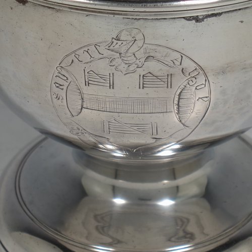 A rare Antique Georgian George II Sterling Silver small table bowl, having a plain round body, with reeded borders, and sitting on a pedestal foot. Made by Fuller White London in 1750. The dimensions of this fine hand-made antique silver bowl are diameter 9 cms (3.5 inches), height 8.5 cms (3.3 inches), and it weighs approx. 217g (7 troy ounces). Please note that this item is crested.
