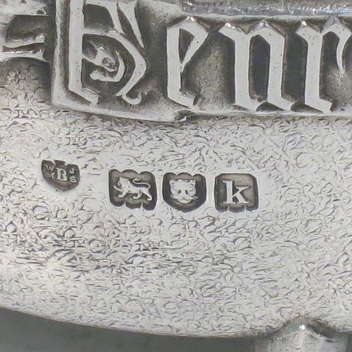 An Antique Edwardian Sterling Silver Arts & Crafts style bowl, being a copy of the Winchester Bushel measure, having a round straight-sided body with a hand-hammered finish, an applied inscription on both sides, with two cast handles, and sitting on four cast feet. Made by the Barnard Brothers of London in 1905. The dimensions of this fine hand-made antique silver bowl are height 8 cms (2.3 inches), diameter 11.5 cms (4.5 inches), and it weighs approx. 325g (10.5 troy ounces).