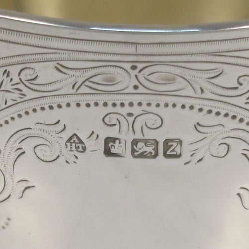 A very pretty Antique Victorian Sterling Silver bowl, having a round body with hand-engraved floral and scroll-work decoration, a gold-gilt interior, and sitting on a flat base. This beautiful antique silver bowl was made by Albert Henry Thompson of Sheffield in 1892. The dimensions of this fine hand-made antique silver bowl are height 6.5 cms (2.75 inches), diameter 10 cms (4 inches), and it weighs approx. 132g (4.3 troy ounces).