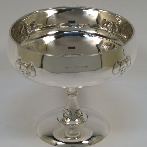 A very pretty Antique Edwardian Sterling Silver Arts & Crafts style bowl, having a round bellied body with hand-chased Lilly style decoration, and sitting on a matching round pedestal foot. This beautiful raised table bowl was made by A. and J. Zimmerman of Birmingham in 1904. The dimensions of this fine hand-made antique silver bowl are height 11 cms (4.3 inches), diameter 13 cms (5 inches), and it weighs approx. 171g (5.5 troy ounces).   