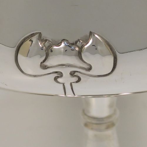 A very pretty Antique Edwardian Sterling Silver Arts & Crafts style bowl, having a round bellied body with hand-chased Lilly style decoration, and sitting on a matching round pedestal foot. This beautiful raised table bowl was made by A. and J. Zimmerman of Birmingham in 1904. The dimensions of this fine hand-made antique silver bowl are height 11 cms (4.3 inches), diameter 13 cms (5 inches), and it weighs approx. 171g (5.5 troy ounces).
