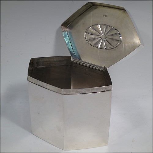 A very handsome and unusual Antique Edwardian Sterling Silver table box, having a hexagonal shaped body with plain straight sides, a hinged lid with an oval fluted centre and hinged loop handle, and all sitting on a flat base. Made by Thomas Bradbury and Sons of Sheffield in 1908. The dimensions of this fine hand-made antique silver table box are height 13 cms (5 inches), length 17 cms (6.75 inches), width 11 cms (4.3 inches), and it weighs approx. 682g (22 troy ounces).    