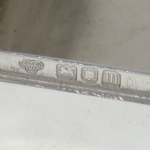 A very handsome Antique Edwardian Sterling Silver table box, having a plain rectangular body, a hinged lid having an applied ribbon and reed border and thumb-piece, and sitting on a flat base. Made by Goldsmiths and Silversmiths of London in 1907. The dimensions of this fine hand-made antique silver table box are length 11.5 cms (4.5 inches), width 5 cms (2 inches), height 3 cms (1.25 inch), and it weighs approx. 148g (4.8 troy ounces).