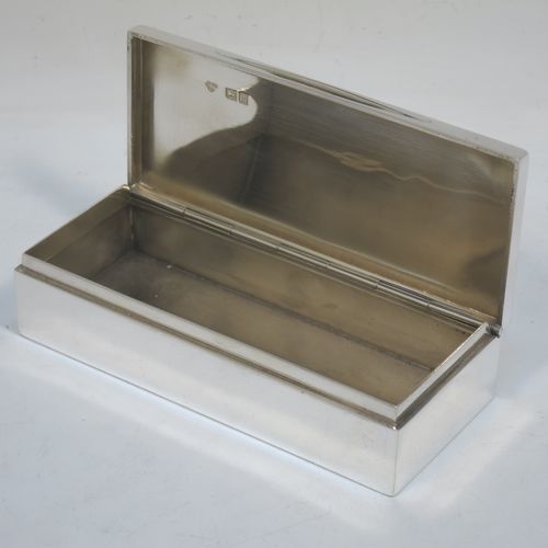 A very handsome Antique Edwardian Sterling Silver table box, having a plain rectangular body, a hinged lid having an applied ribbon and reed border and thumb-piece, and sitting on a flat base. Made by Goldsmiths and Silversmiths of London in 1907. The dimensions of this fine hand-made antique silver table box are length 11.5 cms (4.5 inches), width 5 cms (2 inches), height 3 cms (1.25 inch), and it weighs approx. 148g (4.8 troy ounces).