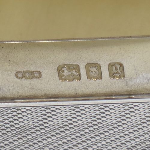 A very elegant Sterling Silver soap or table box, having a rectangular body with rounded corners and engine-turned decoration, a vacant round cartouche on the hinged lid, together with two thumb-pieces, a gold-gilt interior, and all sitting of a flat base. Made by Wright and Davies of London in 1922. The dimensions of this fine hand-made silver table or soap box are length 11 cms (4.3 inches), width 7.5 cms (3 inches), height 5 cms (2 inches), and it weighs approx. 254g (8.2 troy ounces)