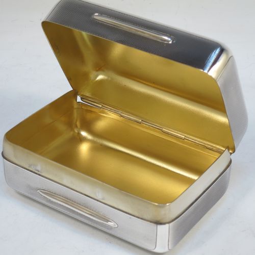 A very elegant Sterling Silver soap or table box, having a rectangular body with rounded corners and engine-turned decoration, a vacant round cartouche on the hinged lid, together with two thumb-pieces, a gold-gilt interior, and all sitting of a flat base. Made by Wright and Davies of London in 1922. The dimensions of this fine hand-made silver table or soap box are length 11 cms (4.3 inches), width 7.5 cms (3 inches), height 5 cms (2 inches), and it weighs approx. 254g (8.2 troy ounces)