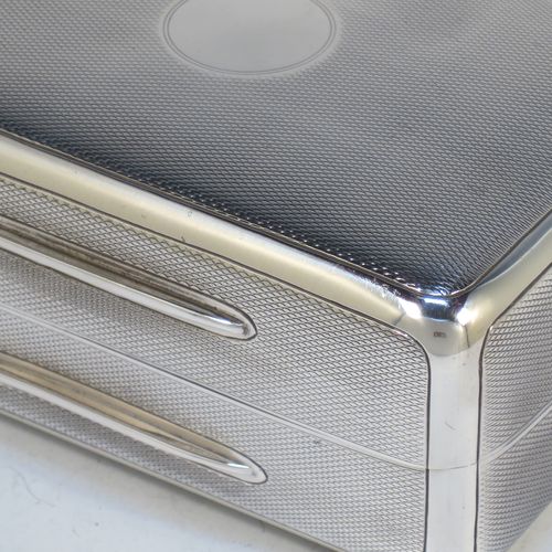 A very elegant Sterling Silver soap or table box, having a rectangular body with rounded corners and engine-turned decoration, a vacant round cartouche on the hinged lid, together with two thumb-pieces, a gold-gilt interior, and all sitting of a flat base. Made by Wright and Davies of London in 1922. The dimensions of this fine hand-made silver table or soap box are length 11 cms (4.3 inches), width 7.5 cms (3 inches), height 5 cms (2 inches), and it weighs approx. 254g (8.2 troy ounces)