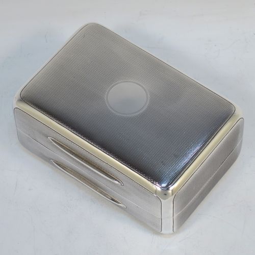 A very elegant Sterling Silver soap or table box, having a rectangular body with rounded corners and engine-turned decoration, a vacant round cartouche on the hinged lid, together with two thumb-pieces, a gold-gilt interior, and all sitting of a flat base. Made by Wright and Davies of London in 1922. The dimensions of this fine hand-made silver table or soap box are length 11 cms (4.3 inches), width 7.5 cms (3 inches), height 5 cms (2 inches), and it weighs approx. 254g (8.2 troy ounces)
