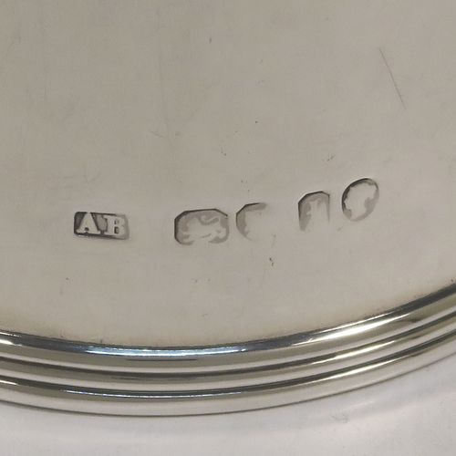 A very unusual and handsome Antique Victorian Sterling Silver brandy or sauce warmer, having a plain round body with tapering sides and reeded borders, a panelled wood turned side handle, a flat hinged lid, and all sitting on a flat base. This elegant antique silver brandy or sauce warmer was made by Alfred Brownett for Aspreys of London in 1866. The dimensions of this fine hand-made brandy sauce warmer are height of main body 11 cms (4.3 inches), diameter at base 7 cms (2.75 inches), length (inc. handle) 15 cms (6 inches), and it weighs approx. 210g (6.8 troy ounces). Please note that this item is crested.