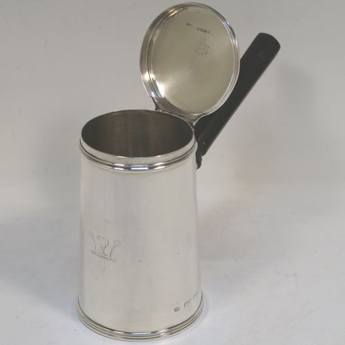 A very unusual and handsome Antique Victorian Sterling Silver brandy or sauce warmer, having a plain round body with tapering sides and reeded borders, a panelled wood turned side handle, a flat hinged lid, and all sitting on a flat base. This elegant antique silver brandy or sauce warmer was made by Alfred Brownett for Aspreys of London in 1866. The dimensions of this fine hand-made brandy sauce warmer are height of main body 11 cms (4.3 inches), diameter at base 7 cms (2.75 inches), length (inc. handle) 15 cms (6 inches), and it weighs approx. 210g (6.8 troy ounces). Please note that this item is crested.