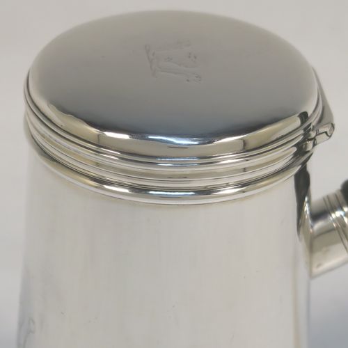 A very unusual and handsome Antique Victorian Sterling Silver brandy or sauce warmer, having a plain round body with tapering sides and reeded borders, a panelled wood turned side handle, a flat hinged lid, and all sitting on a flat base. This elegant antique silver brandy or sauce warmer was made by Alfred Brownett for Aspreys of London in 1866. The dimensions of this fine hand-made brandy sauce warmer are height of main body 11 cms (4.3 inches), diameter at base 7 cms (2.75 inches), length (inc. handle) 15 cms (6 inches), and it weighs approx. 210g (6.8 troy ounces). Please note that this item is crested.