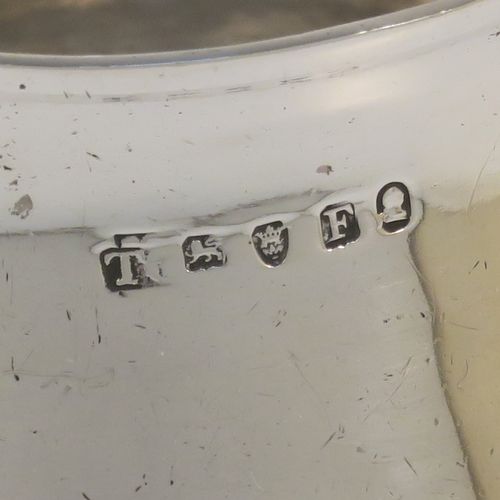A handsome Antique Georgian Sterling Silver brandy saucepan warmer, having a plain round bellied body, a sparrow-beak spout, an original wood turned handle, and sitting on a flat base. This elegant antique silver brandy or sauce warmer was made by Thomas Oliphant of London in 1801. The dimensions of this fine hand-made silver sauce or brandy warmer are height (inc. handle) 15 cms (6 inches), length (inc. handle) 19 cms (7.5 inches), diameter of main body 9 cms (3.5 inches), and it weighs approx. 150g (4.8 troy ounces).