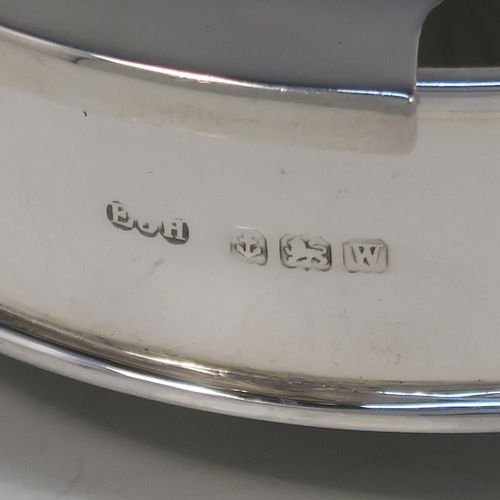 A handsome Sterling Silver and crystal butter dish and cover, having a very plain round body with straight sides, an original frosted crystal liner with star-cut base, a plain round and domes lift off lid, and all sitting on three flange feet. This elegant silver butter dish and cover was made by E. J. Houlston of Birmingham in 1946. The dimensions of this fine hand-made silver butter dish and cover are diameter 10 cms (4 inches), height 5 cms (2 inches), with a total weight of approx. 92g (3 troy ounces).