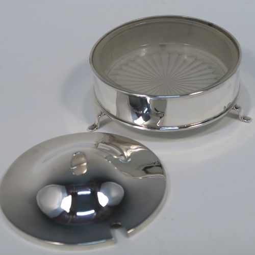 A handsome Sterling Silver and crystal butter dish and cover, having a very plain round body with straight sides, an original frosted crystal liner with star-cut base, a plain round and domes lift off lid, and all sitting on three flange feet. This elegant silver butter dish and cover was made by E. J. Houlston of Birmingham in 1946. The dimensions of this fine hand-made silver butter dish and cover are diameter 10 cms (4 inches), height 5 cms (2 inches), with a total weight of approx. 92g (3 troy ounces).
