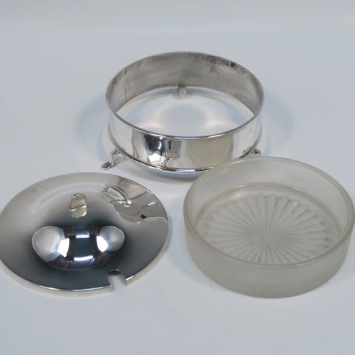 A handsome Sterling Silver and crystal butter dish and cover, having a very plain round body with straight sides, an original frosted crystal liner with star-cut base, a plain round and domes lift off lid, and all sitting on three flange feet. This elegant silver butter dish and cover was made by E. J. Houlston of Birmingham in 1946. The dimensions of this fine hand-made silver butter dish and cover are diameter 10 cms (4 inches), height 5 cms (2 inches), with a total weight of approx. 92g (3 troy ounces).