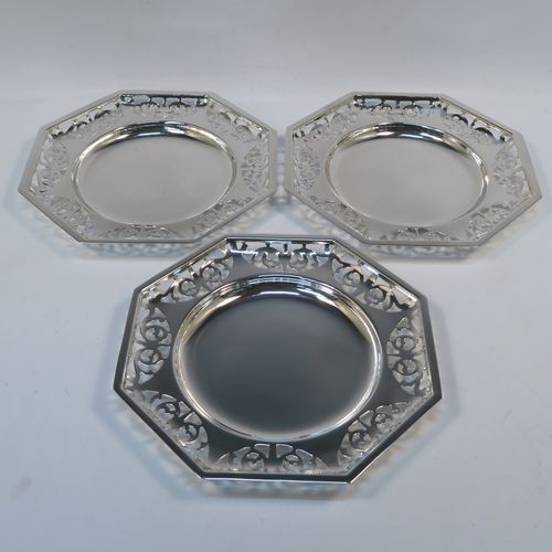A very pretty Antique Edwardian silver plated three-tier cake stand, having a suite of three removable octagonal plates with hand-pierced scroll borders, sitting within a frame with four scroll-work feet. This beautiful antique silver-plated cake stand was made in ca. 1910. The dimensions of this fine hand-made antique silver-plated cake stand are height 41 cms (16 inches), width at feet 30.5 cms (12 inches), and diameter of plates 21.5 cms cms (8.5 inches).