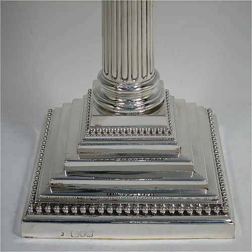 A very pretty Antique Victorian Sterling Silver single candelabrum, having three lights in a Corinthian style with a stepped square base, a fluted round column, double swirl acanthus leaf arms and capitals, removable nozzles with drip pans and central extinguisher with cast flame finial, and bead-edged borders. Made by Fordham and Faulkner of London in 1897. The dimensions of this fine hand-made antique silver single candelabrum are height 63.5 cms (25 inches), and spread across arms 38 cms (15 inches).
