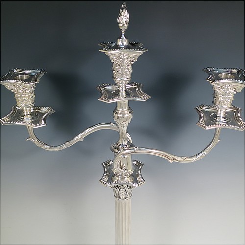 A very pretty Antique Victorian Sterling Silver single candelabrum, having three lights in a Corinthian style with a stepped square base, a fluted round column, double swirl acanthus leaf arms and capitals, removable nozzles with drip pans and central extinguisher with cast flame finial, and bead-edged borders. Made by Fordham and Faulkner of London in 1897. The dimensions of this fine hand-made antique silver single candelabrum are height 63.5 cms (25 inches), and spread across arms 38 cms (15 inches).