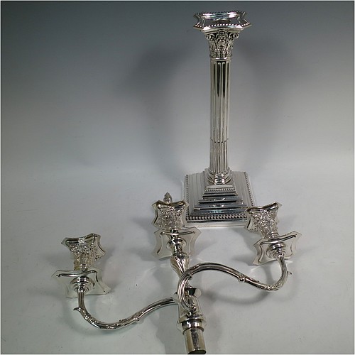 A very pretty Antique Victorian Sterling Silver single candelabrum, having three lights in a Corinthian style with a stepped square base, a fluted round column, double swirl acanthus leaf arms and capitals, removable nozzles with drip pans and central extinguisher with cast flame finial, and bead-edged borders. Made by Fordham and Faulkner of London in 1897. The dimensions of this fine hand-made antique silver single candelabrum are height 63.5 cms (25 inches), and spread across arms 38 cms (15 inches).