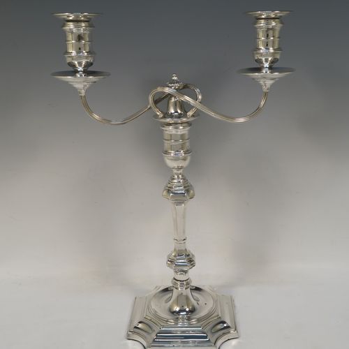 A very handsome pair of Antique Victorian two-light Silver Plated Georgian style candelabra, having cut-corner square bases, panelled baluster columns, with removable swirl and reeded arms, and matching capitals with drip pans and removable nozzles. Made by Elkington and Co., with a date letter for 1896. The dimensions of this fine hand-made pair silver-plated Georgian style  candelabra are height 35 cms (13.75 inches), and spread across arms 25 cms (10 inches).  