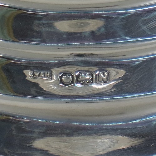 A very unusual and handsome Sterling Silver pair of Art Deco style candlesticks, having round stepped bases, plain round straight-sided columns, with stepped capitals and removable nozzles. Made by Walker and Hall of Sheffield in 1955. The dimensions of these fine hand-made Art Deco style silver table candlesticks are height 21 cms (8.25 inches), and diameter at base 12 cms (4.75 inches).